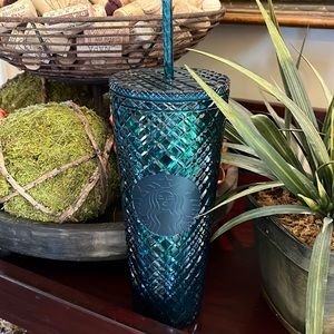 Starbucks Venti green jeweled tumbler.